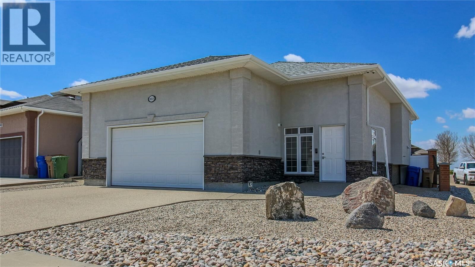 Property Photo:  8018 Fairways West Drive  SK S4Y 0A5 