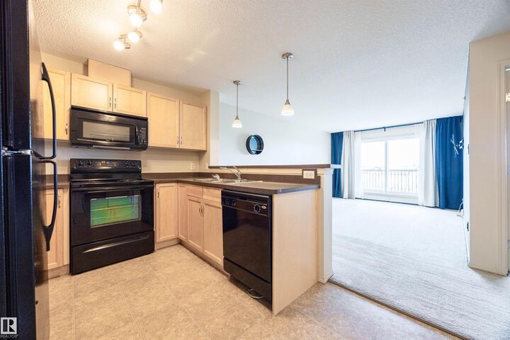 Property Photo: 5951 165 Avenue NW 404 AB T5Y 0J6