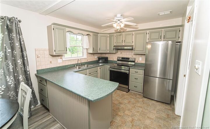 Property Photo:  519 Gardiner Street  NB E2V 1G5 