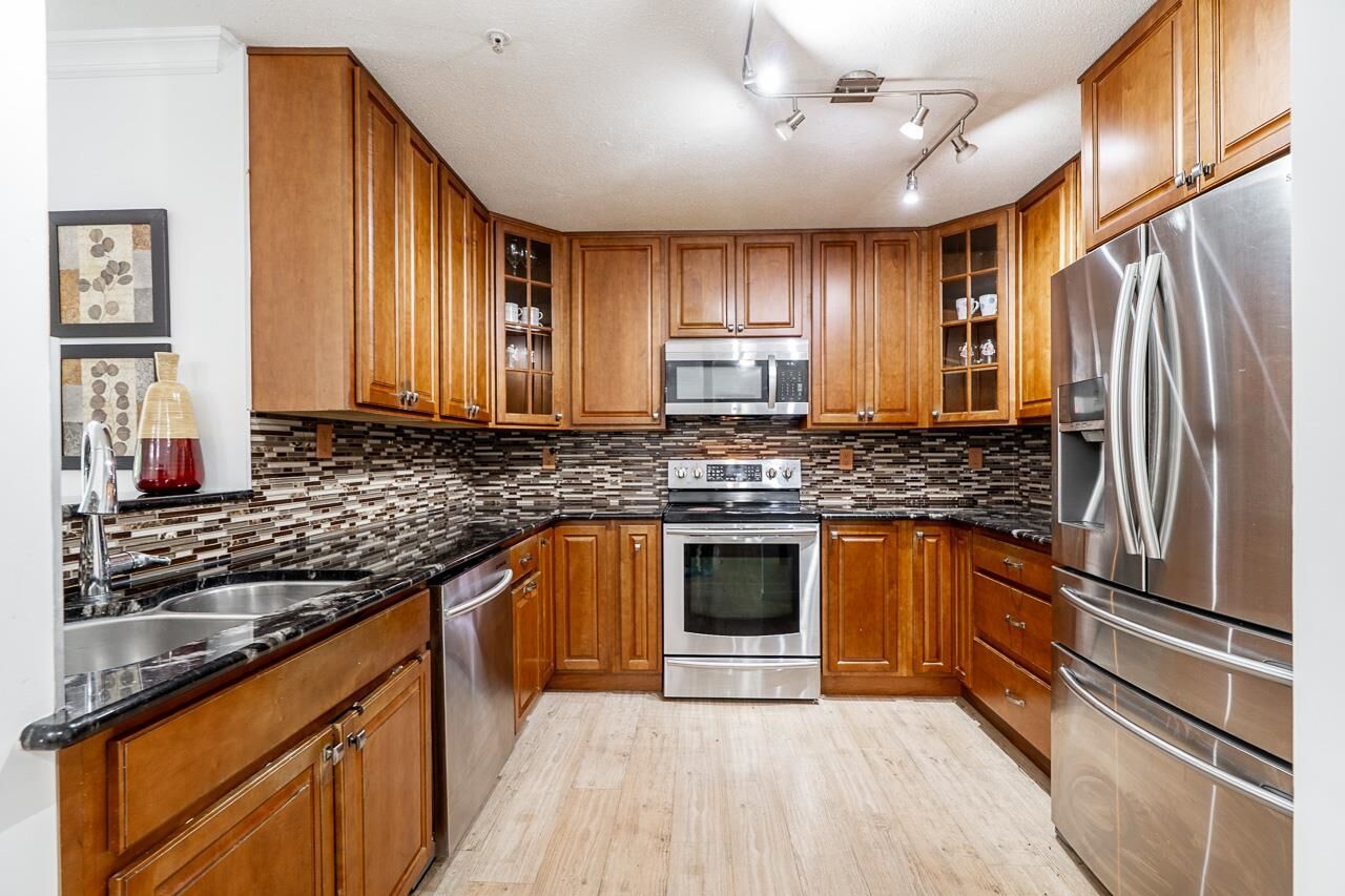 Property Photo: 20881 56 Avenue 211 BC V3A 3Z3