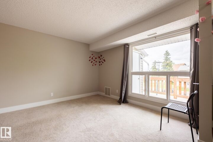 Property Photo:  2703 79 Street NW 8  AB T6K 3Z6 