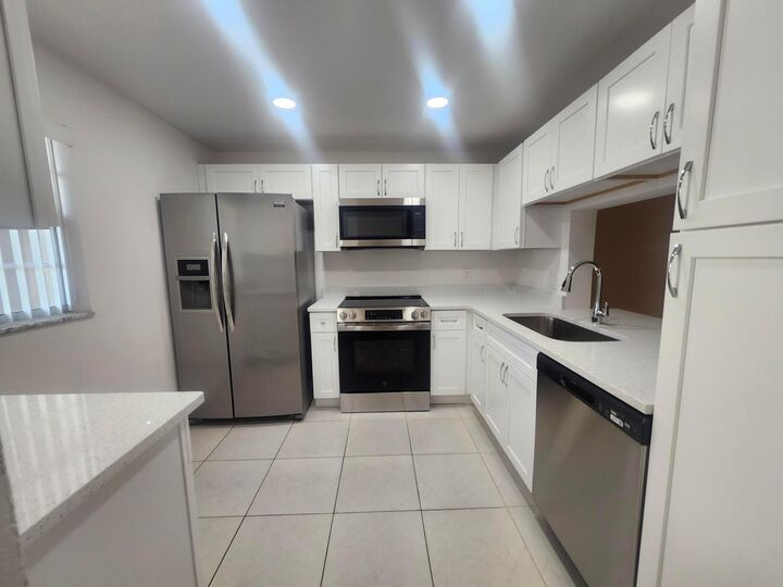Property Photo:  330 NE 26th Avenue 202  FL 33435 