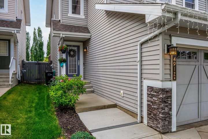 Property Photo:  4912 213 Street NW  AB T6M 0G6 