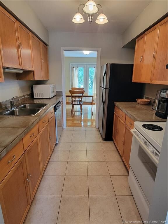 Property Photo:  59 Brentwood Crescent  NB E2K 4S1 