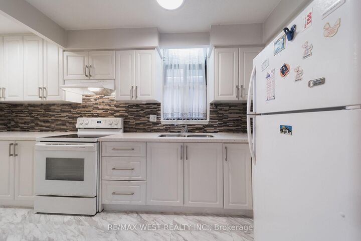 Property Photo: 50 Old Kingston Road 1-202 ON M1E 4Y1
