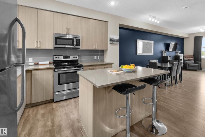 Property Photo:  2803 James Mowatt Trail SW 13  AB T6W 2P5 