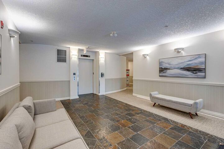 Property Photo: 10 Hemlock Crescent SW 303 AB T3C 2Z1