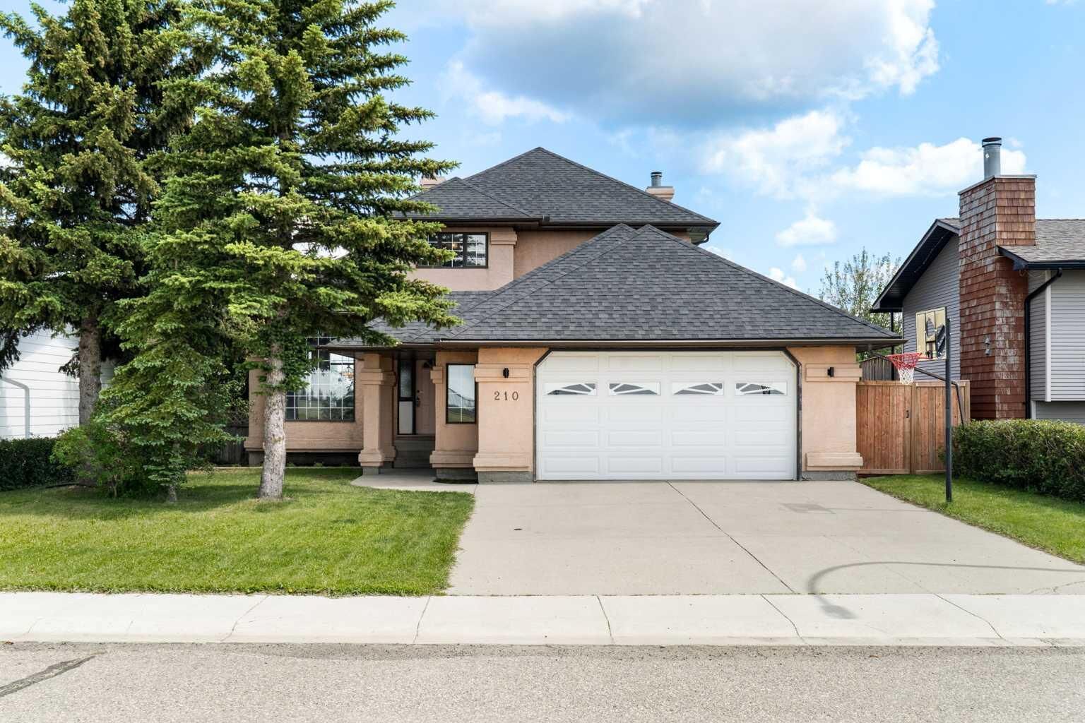 Property Photo:  210 McKinnon Drive  AB T0J 0M0 