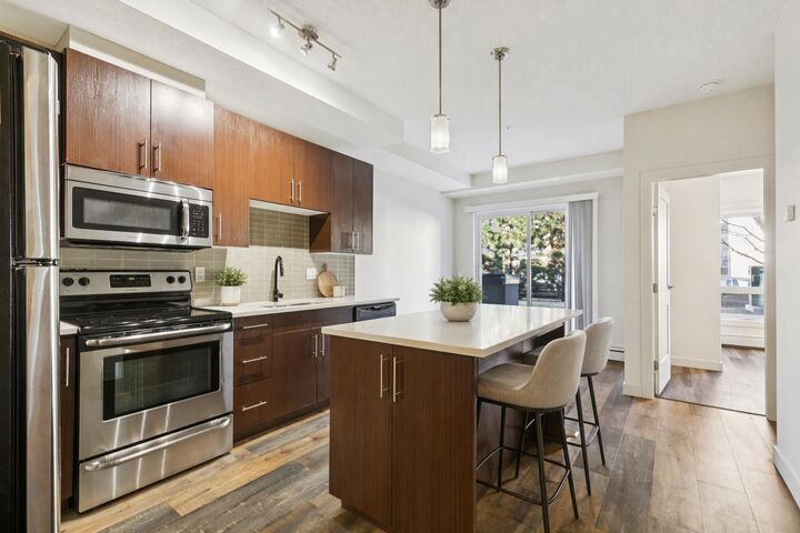 Property Photo: 15233 1 Street SE 108 AB T2X 0X5