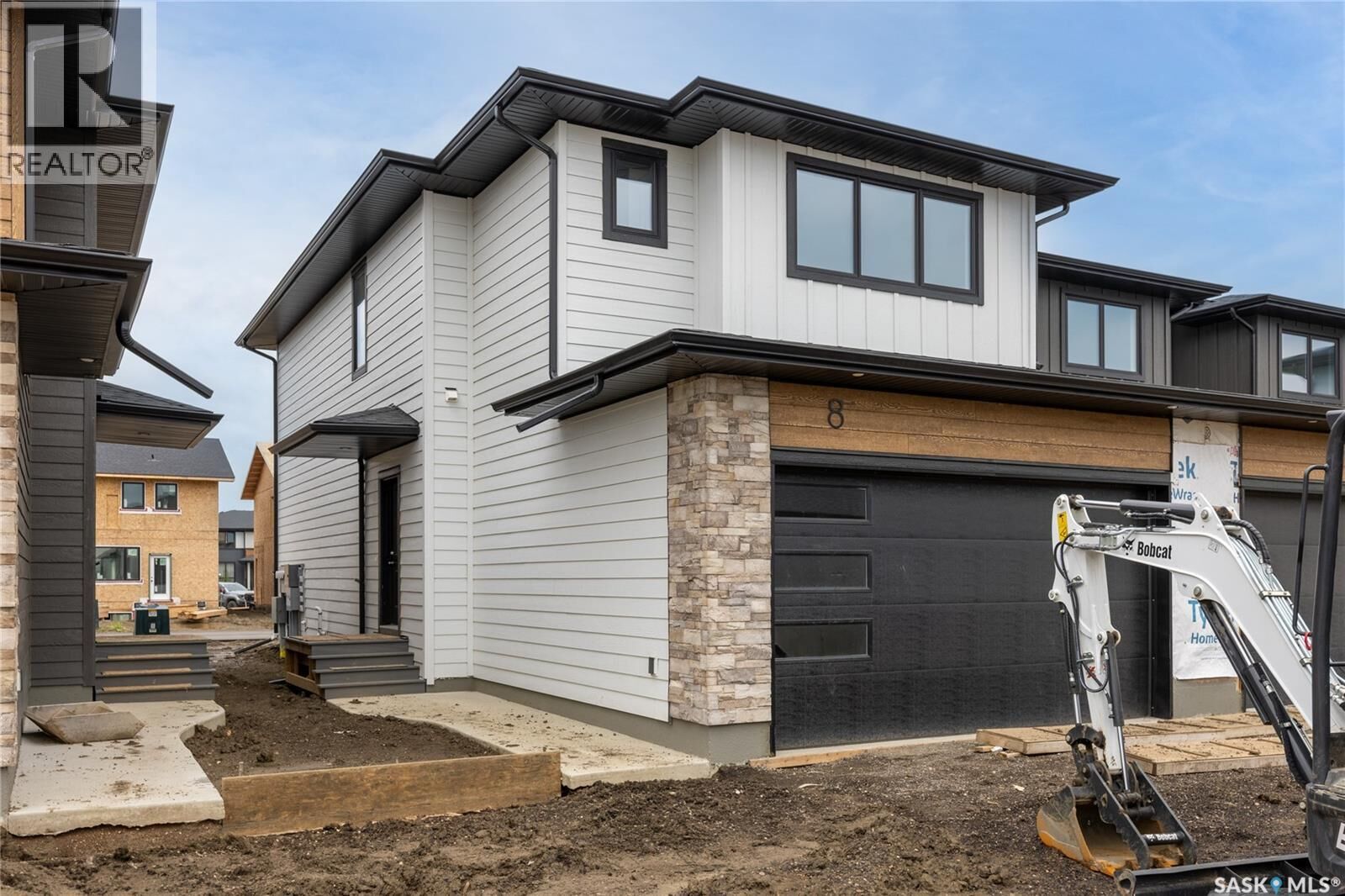 Property Photo:  8 830 Brighton Boulevard  SK S7V 2A8 