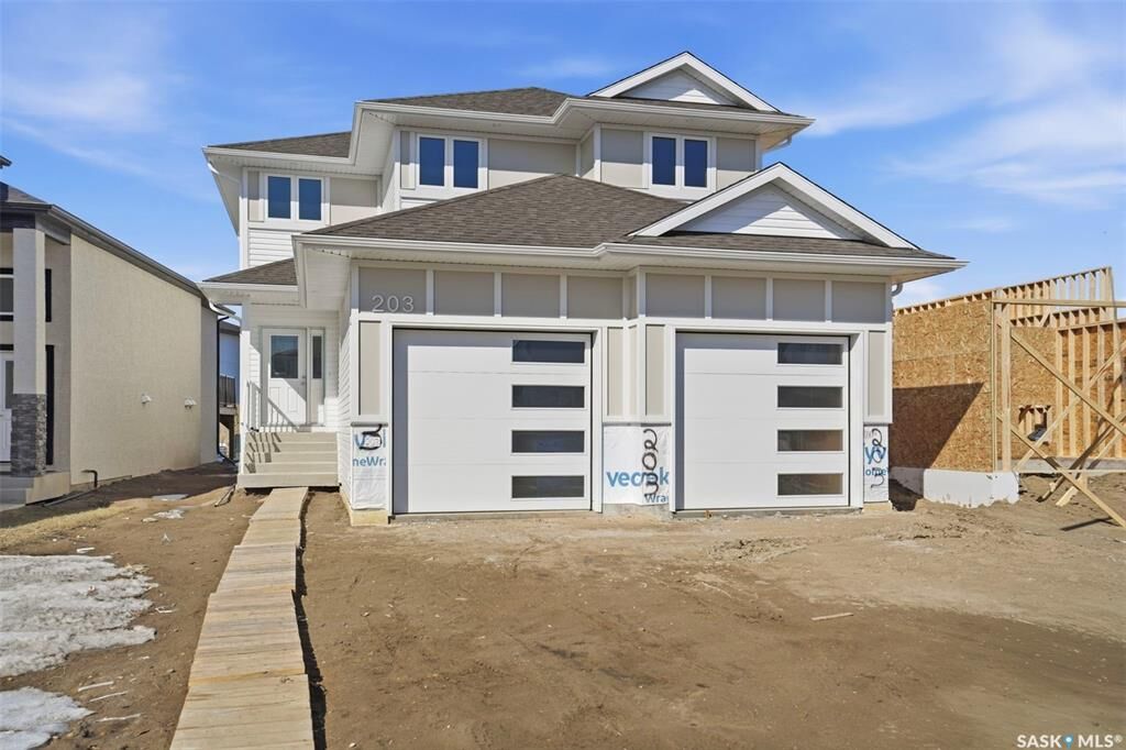 Property Photo: 203 Sharma Lane SK S7W 0Y4