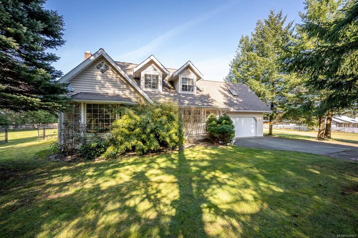 Property Photo:  6104 Ledingham Rd  BC V9J 1M9 