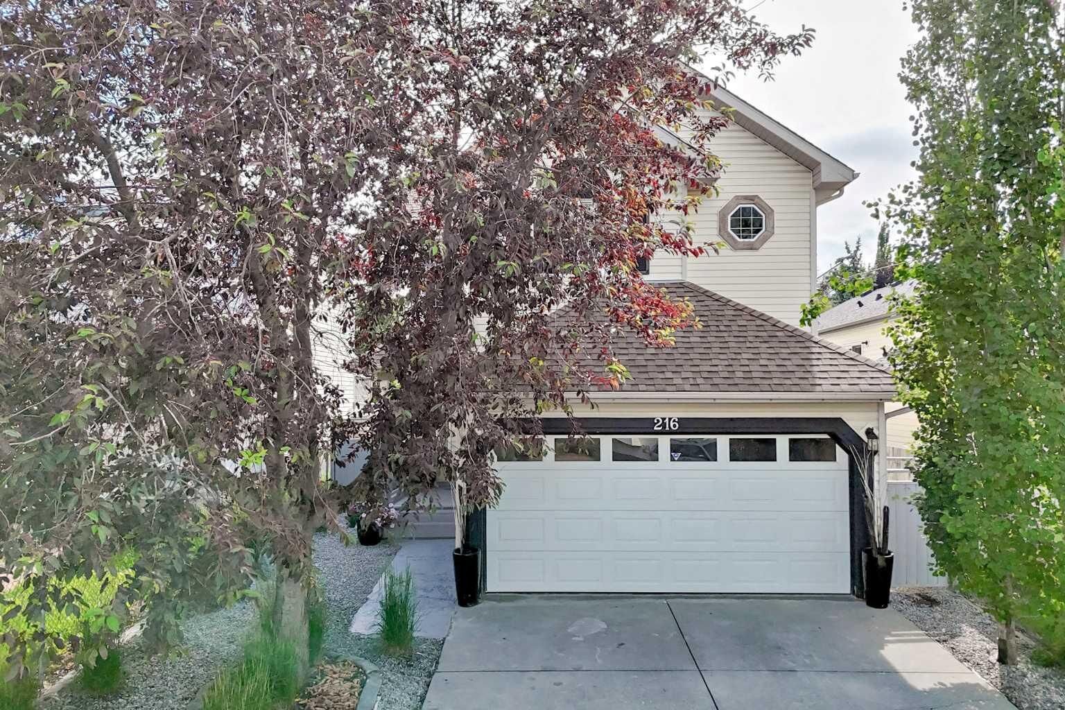 Property Photo:  216 Hidden Spring Green NW  AB T3A 5N4 