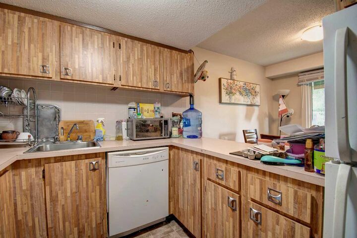Property Photo: 2200 Woodview Drive SW 106 AB T2W 3N6