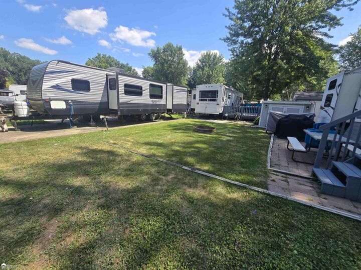 Property Photo:  10001 Goodall Road 57  MI 48429 
