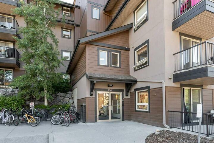 Property Photo:  186 Kananaskis Way 216  AB T1W 0A2 