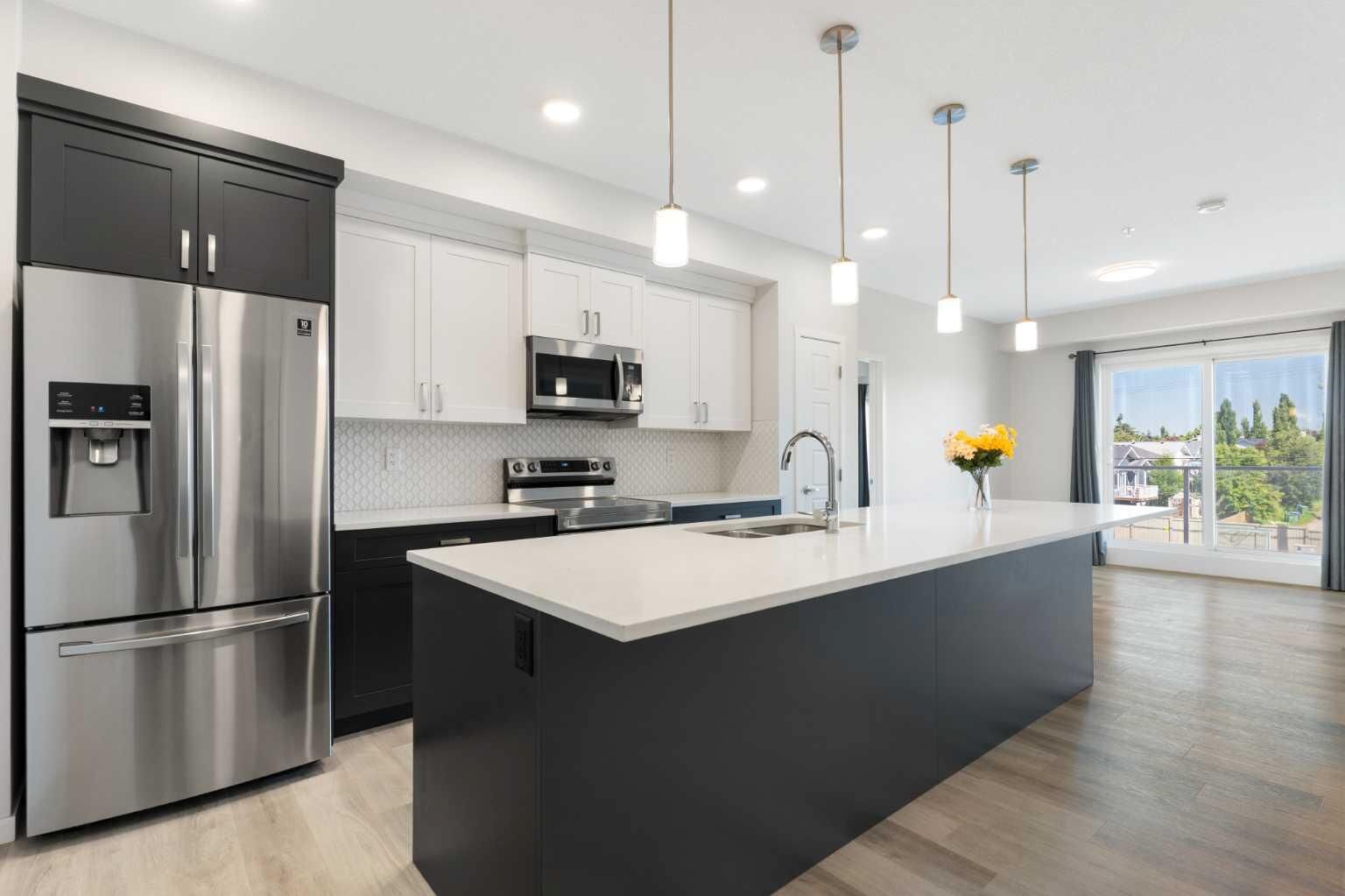 Property Photo: 200 Harvest Hills Place NE 305 AB T3K 2N3