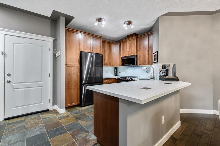 Property Photo: 20 Discovery Ridge Close SW 233 AB T3H 5X4