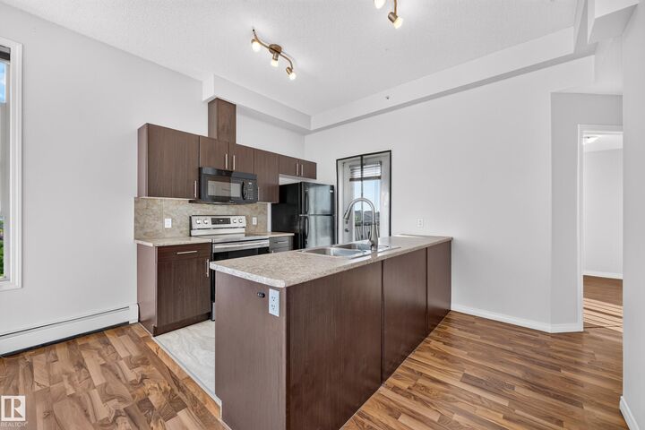 Property Photo: 105 Ambleside Drive SW 406 AB T6W 0J4