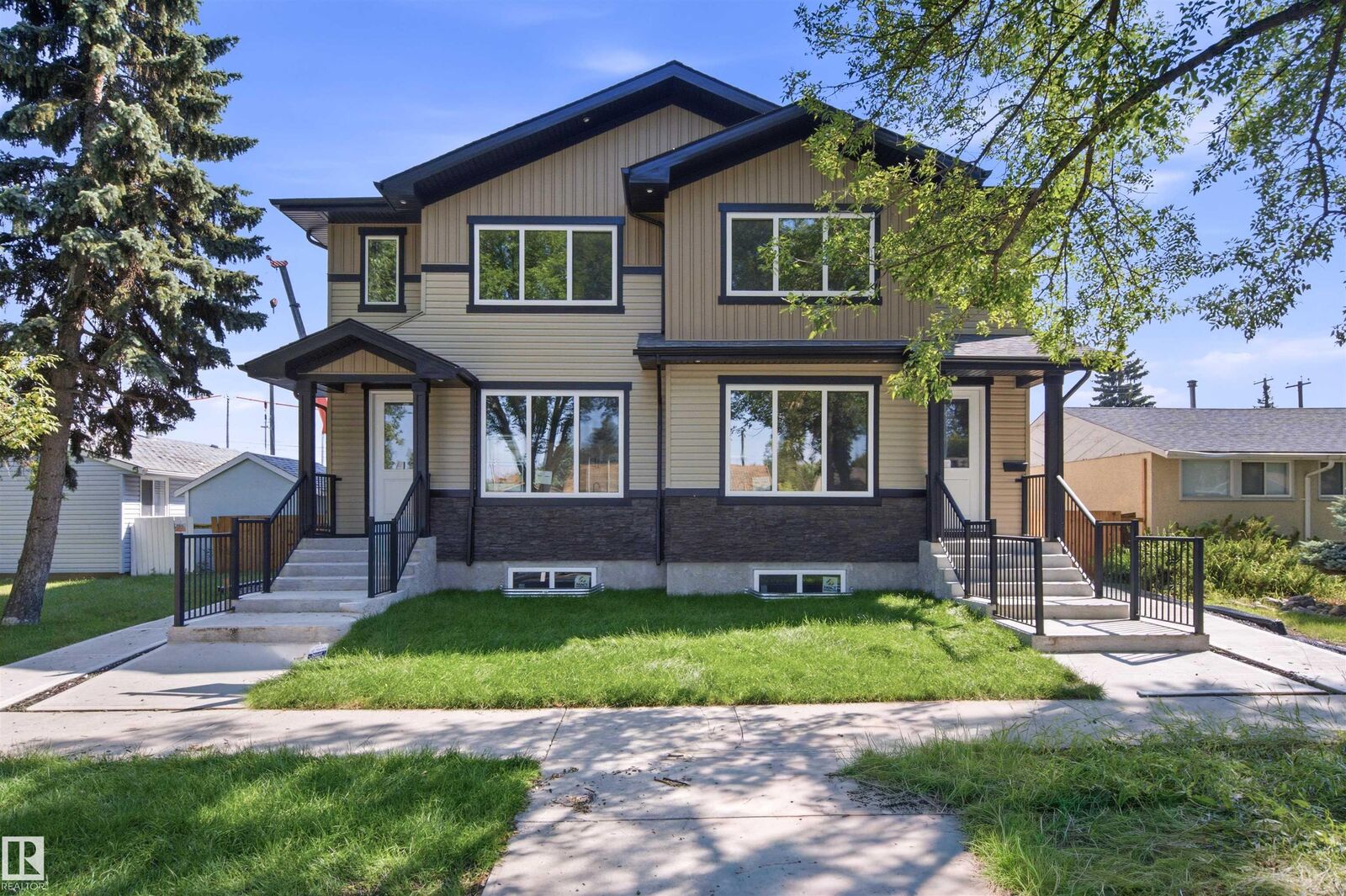 Property Photo: 10707-09 128 Avenue NW AB T5E 0J4