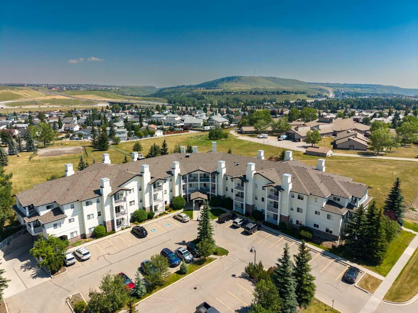 Property Photo: 72 Quigley Drive 201 AB T4C 2K6