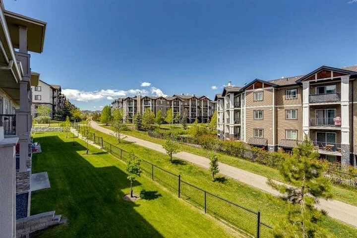 Property Photo: 22 Panatella Road NW 207 AB T3K 0V4