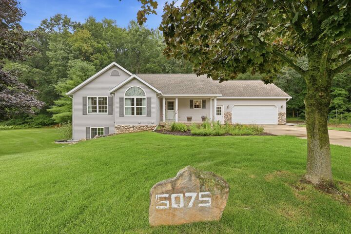 Property Photo:  5075 Bonasa Drive NE  MI 49341 