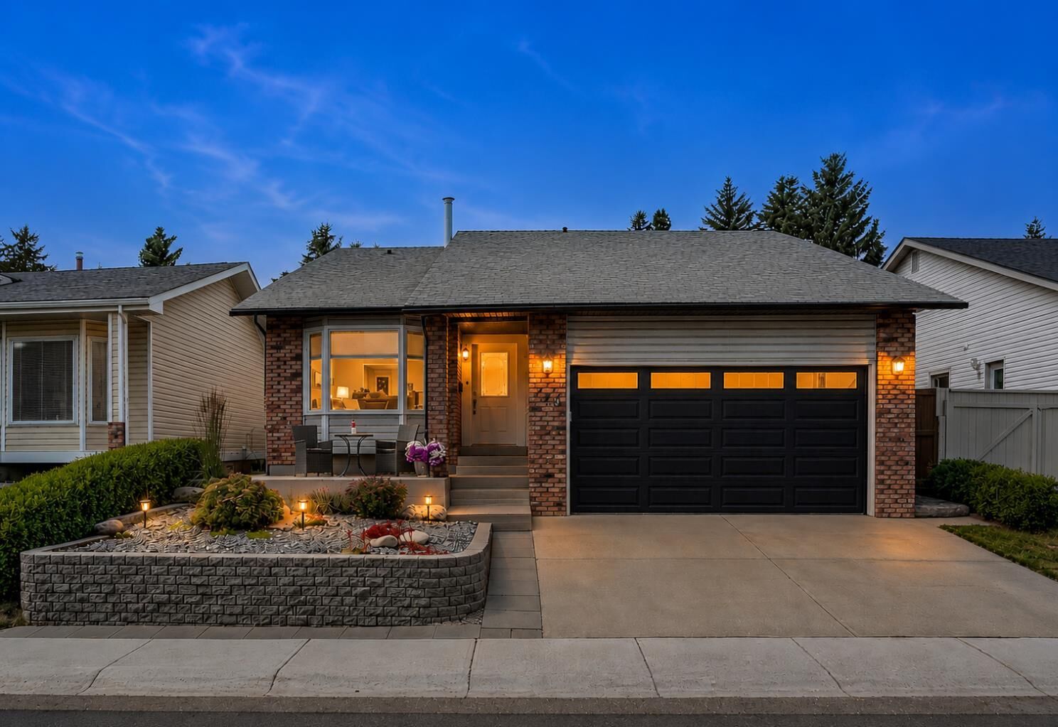 Property Photo: 140 Woodglen Way SW AB T2W 4T3