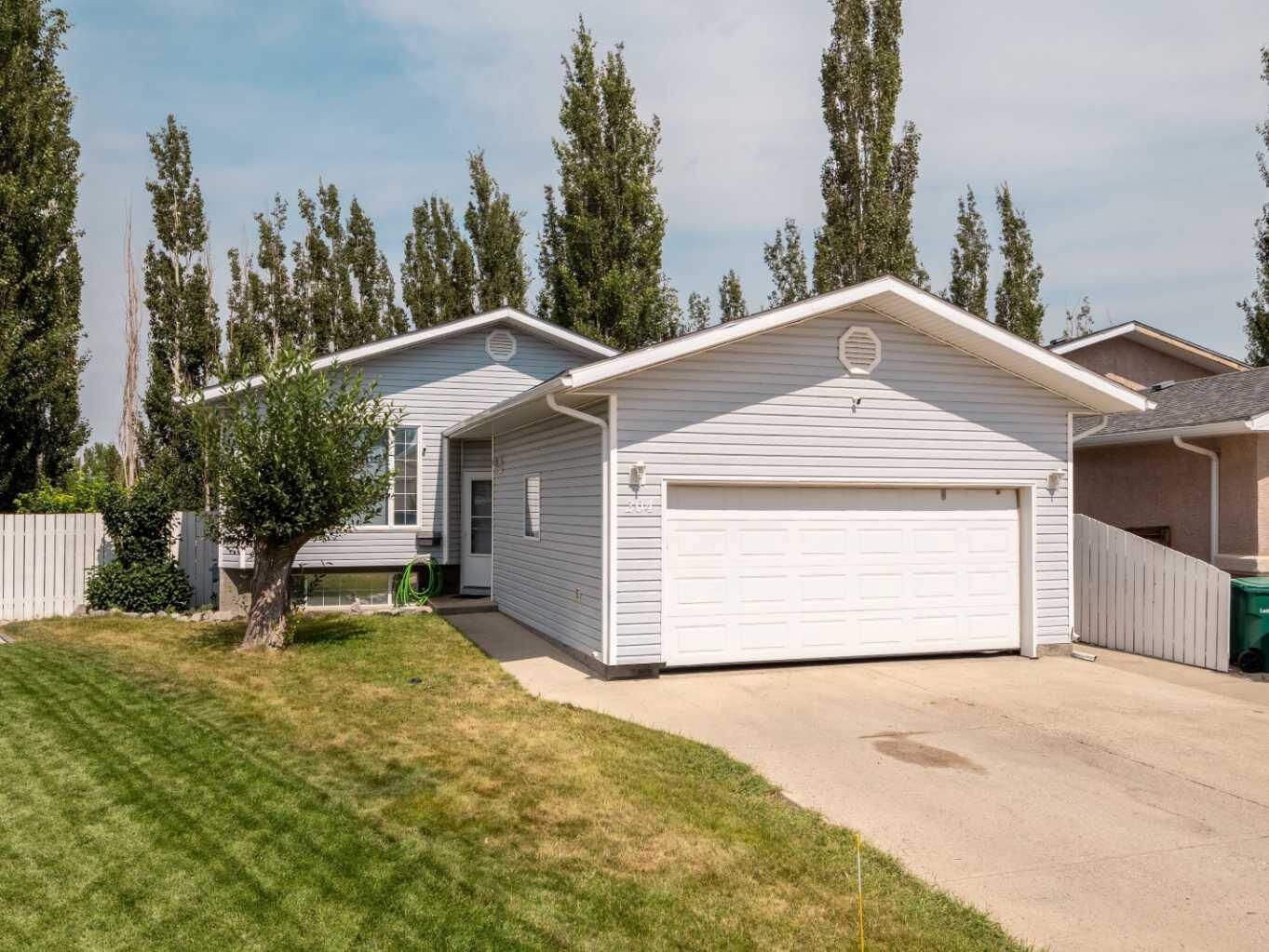 Property Photo: 204 Mt Rundle Road W AB T1K 7E9