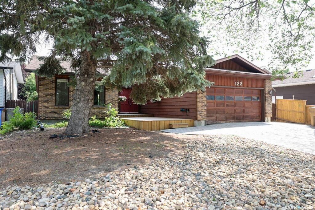 Property Photo: 122 Edenwold Crescent SK S4R 8A3