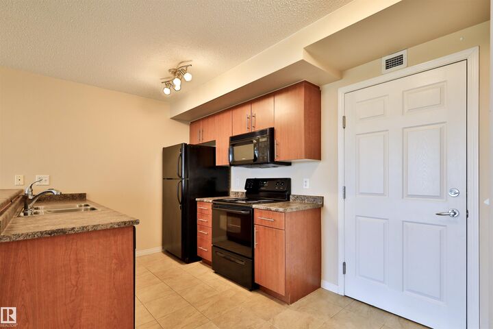 Property Photo: 6925 199 Street NW 213 AB T5T 3X8