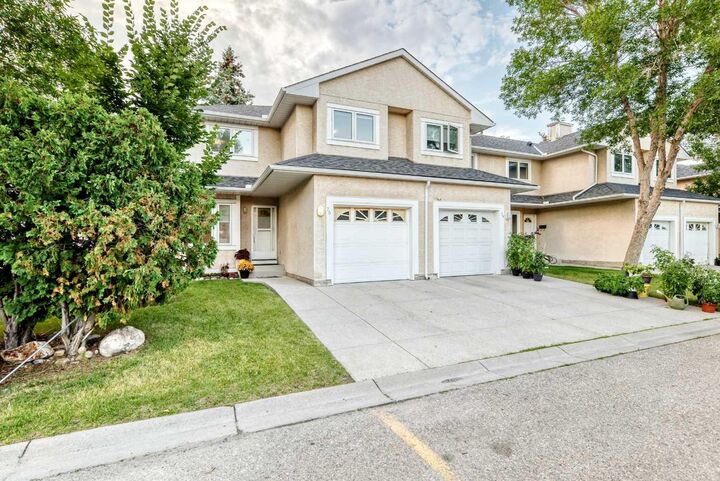 Property Photo:  388 Sandarac Drive NW 76  AB T3K 4E3 