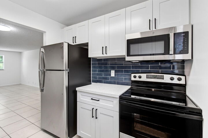 Property Photo:  450 SW 2nd Avenue 205  FL 33432 