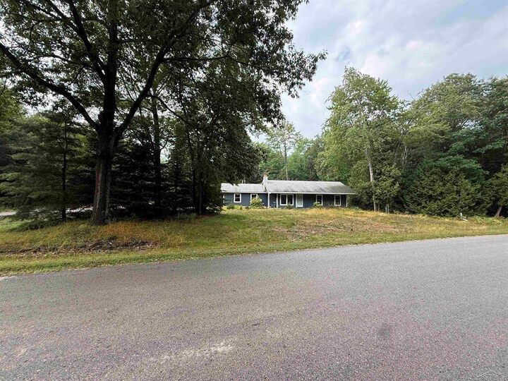 Property Photo:  4879 Kingswood Lane  MI 48750 