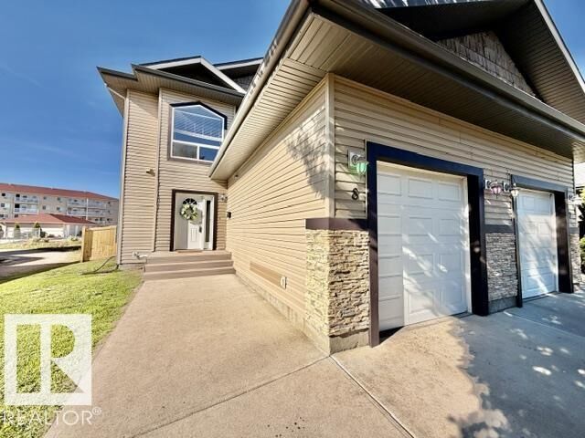 Property Photo:  4702 57 Avenue 8  AB T9A 3S9 
