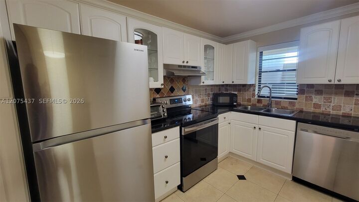 Property Photo:  2410 Deer Creek Country Club Blvd 310E  FL 33442 