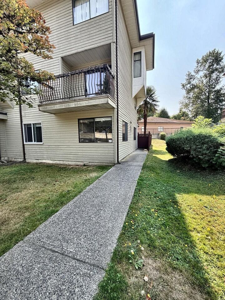 Property Photo: 7131 133A Street 101 BC V3W 8A1