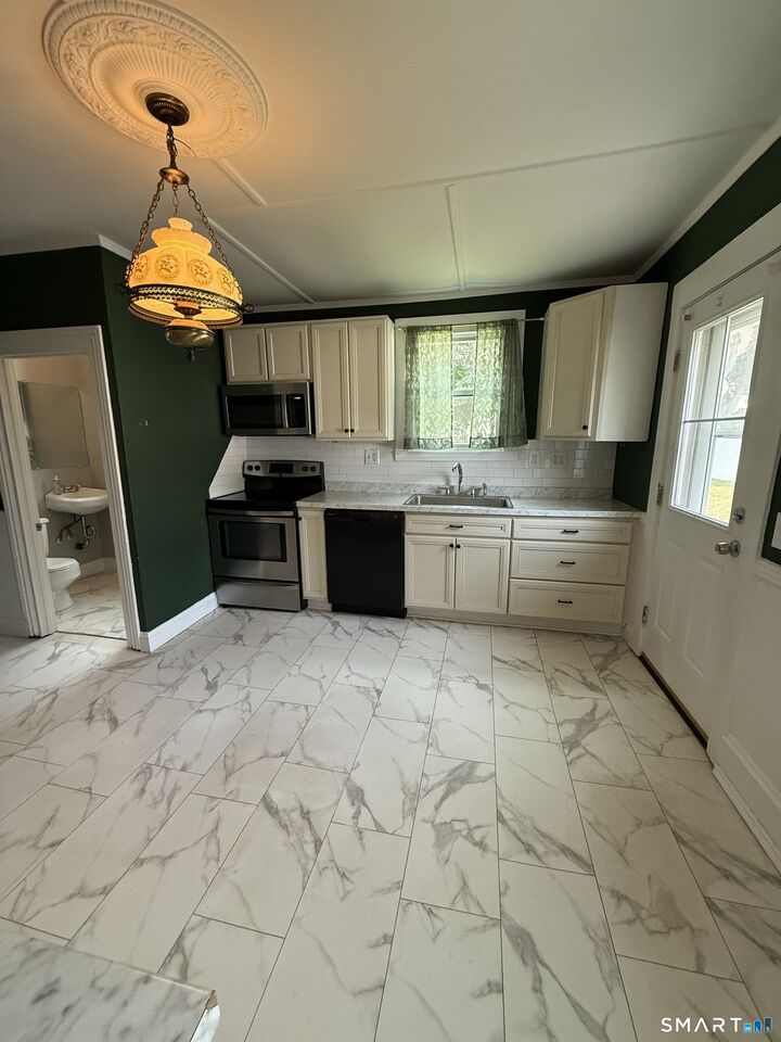 Property Photo: 65 Maple Street 67 CT 06040