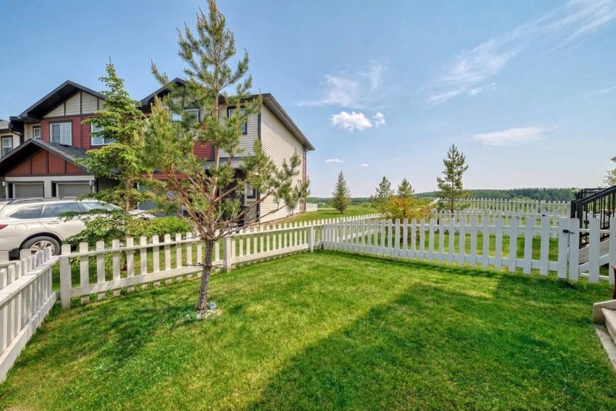 Property Photo:  1402 Jumping Pound Common  AB T4C 2L1 