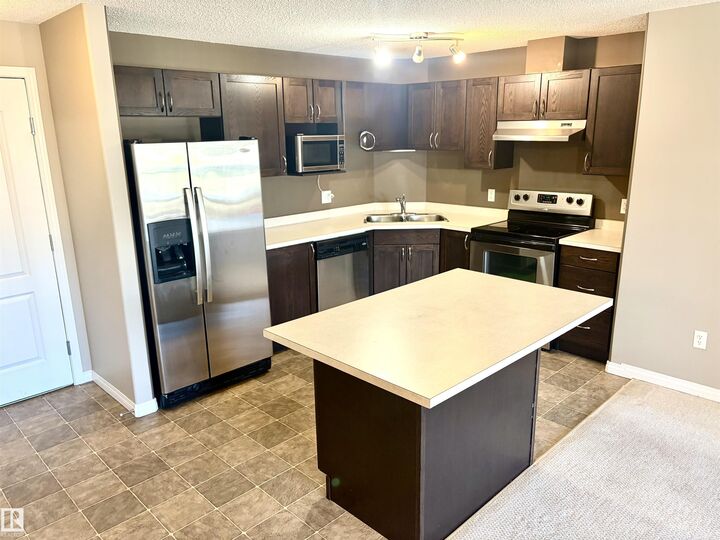 Property Photo: 9363 Simpson Drive NW 1304 AB T6R 0N2