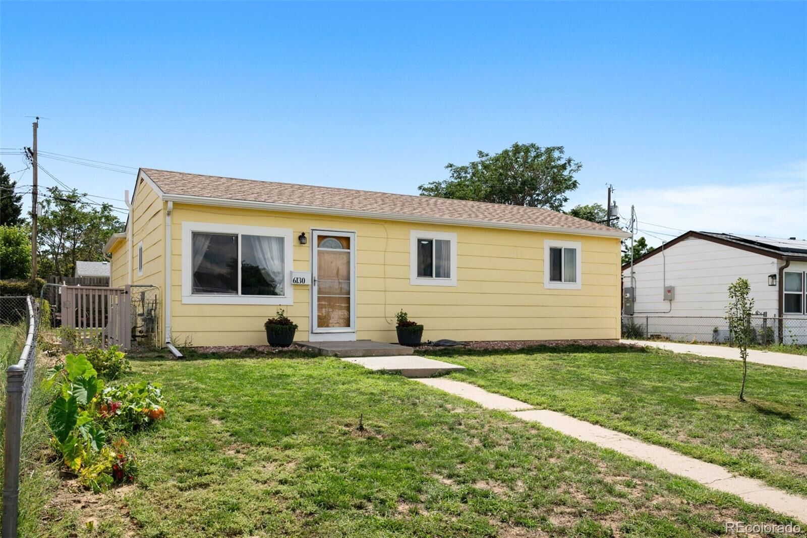 Property Photo: 6130 E 61st Avenue CO 80022