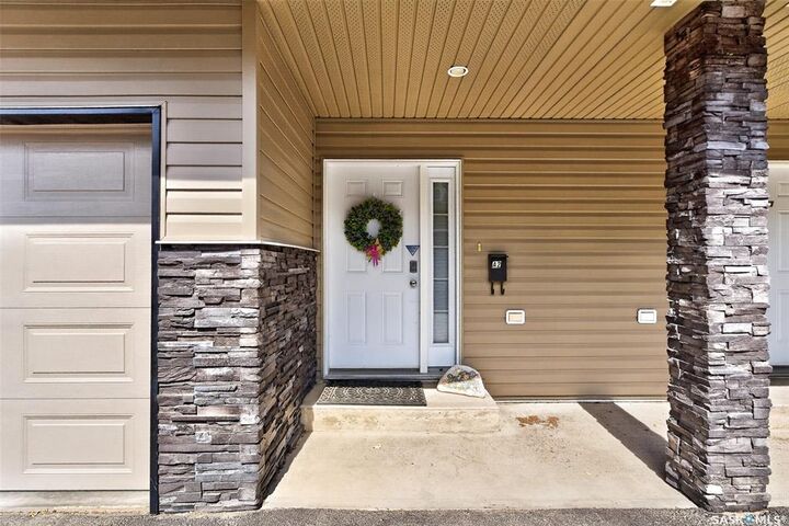 Property Photo:  33 Wood Lily Drive A2  SK S6J 1B4 