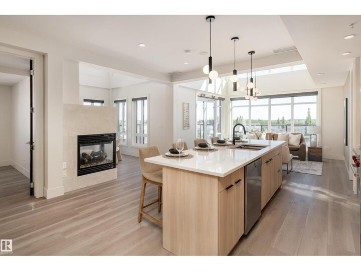 Property Photo:  #401 1350 Windermere Wy SW  AB T6W 2J3 