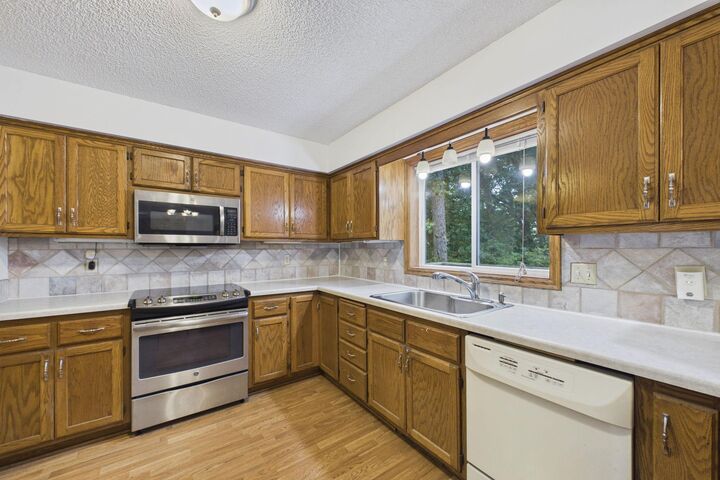 Property Photo:  7018 43rd Street N  MN 55128 