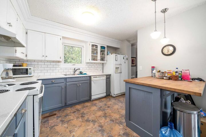 Property Photo:  190014 12 Street W 2  AB T1R 1C7 