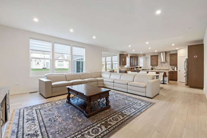 The family room opens to the kitchen and the sunroom.