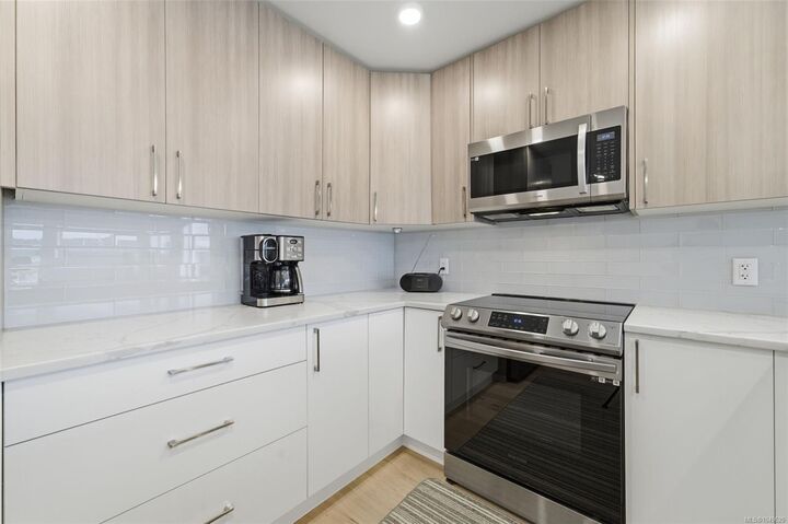 Property Photo:  7098 Wallace Dr #301  BC V8M 1E9 