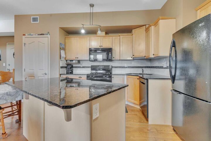 Property Photo:  5040 53 Street 412  AB T4A 0A1 