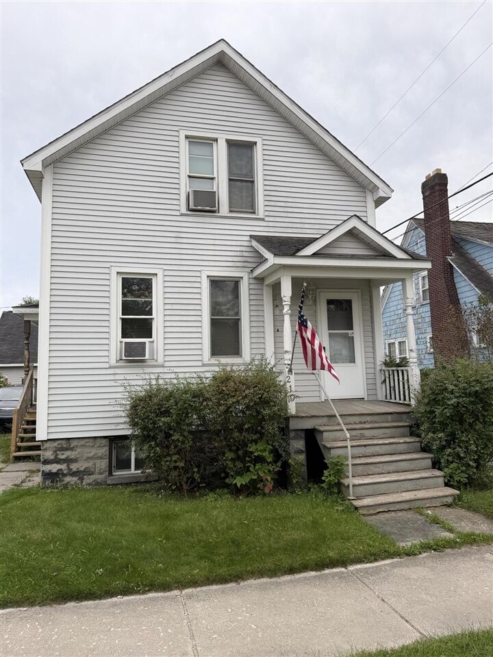 Property Photo:  210 S 7th Avenue  MI 49707-2524 