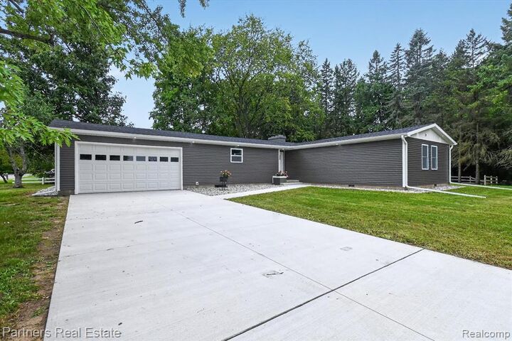 Property Photo: 204 Greenfield Drive MI 48858 2946